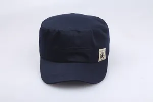Detail of navy cotton cadet cap featuring a side pentagram star fabric patch ornament