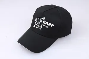 Detail of black cotton carp fishing cap showing fabric texture and white embroidery