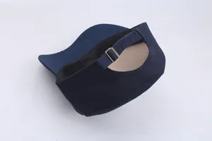 Detail of adjustable metal buckle and navy blue twill cotton strap on flat top cap