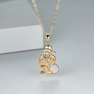 Detailed close-up of a golden Santa Claus pendant with micro-pave white cubic zirconia