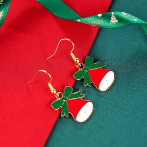 Festive red and white Christmas bell earrings with green bows and golden hooks