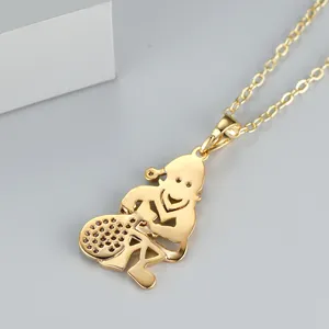 Detail of a golden cartoon pendant necklace with sparkling accents on a white display