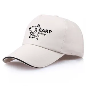 Beige baseball cap featuring a black carp fish print and CARP fishing text detail