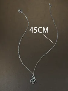 Detail of 45cm silver chain with a sparkling rhinestone-studded Christmas tree pendant