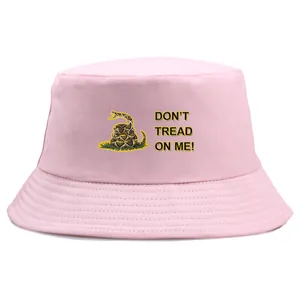 Pink cotton bucket hat with yellow Gadsden snake and Don't Tread On Me print on white background