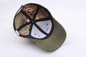 Internal view of camouflage tactical cap showing reinforced seams and care label