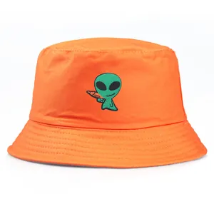 Bright orange cotton bucket hat featuring a green alien embroidery on the front side