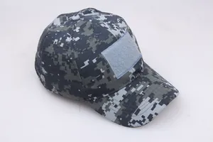 Detailed view of digital pixel camouflage tactical cap with front hook and loop patch area