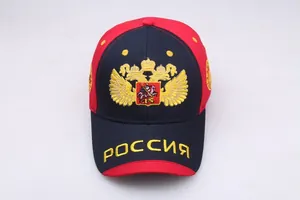 Detail of embroidered Russian double-headed eagle emblem on navy baseball cap