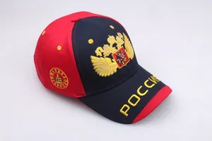 Detailed golden double-headed eagle embroidery on red and blue baseball cap