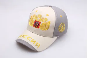 Detailed macro view of the gold double-headed eagle embroidery on a baseball cap