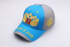 Detailed embroidery of Russian double-headed eagle and text on blue and gray baseball cap