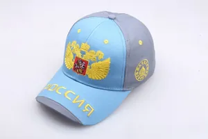 Detailed golden embroidery of Russian coat of arms and text on two-tone baseball cap