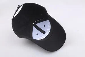 Internal view of black SECURITY baseball cap featuring adjustable strap with white embroidery