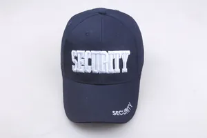 Detail of white SECURITY embroidery on navy blue cotton baseball cap crown and brim
