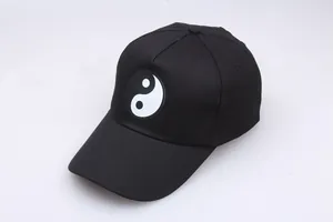 Black cotton baseball cap with Tai Chi Yin Yang print featuring adjustable five-panel design