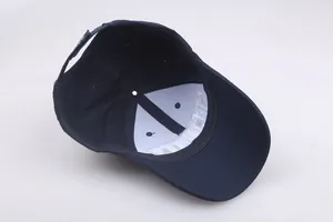 Detailed interior of navy blue cotton baseball cap showing structural lining and stitching