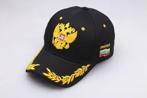 Detailed golden double-headed eagle embroidery on a black Russian baseball cap