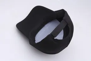 Internal structure of black baseball cap showing durable stitching and adjustable strap