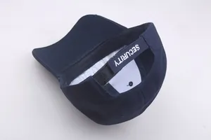 Detail view of navy cotton baseball cap with adjustable Velcro strap and SECURITY embroidery