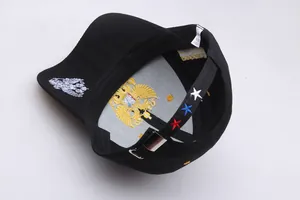 Detail of Russian eagle embroidery and adjustable metal buckle on black baseball cap