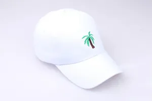 Close-up of high-quality palm tree embroidery on a white cotton baseball cap crown