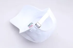 Close-up of white cotton baseball cap showing metal buckle and red rose embroidery
