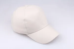 Detail view of the high-quality cotton twill texture and stitching on the beige baseball cap