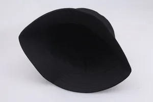 Detail of internal stitching and reinforced seams on a black cotton bucket sun hat
