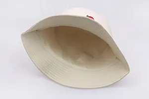 Detailed close-up of rose embroidery and premium inner fabric lining on the bucket hat