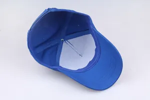 Internal structure of royal blue baseball cap with white support lining and neat stitching