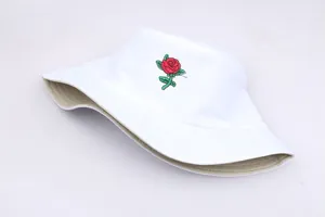 Close-up of high-quality red rose embroidery on a white cotton bucket sun hat for women