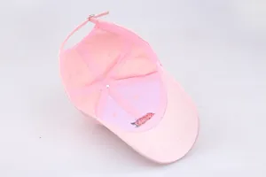 Detail showing the inner structure, seams, and adjustable metal buckle of the pink cap