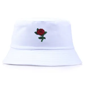 White cotton bucket hat featuring a delicate red rose embroidery on the front