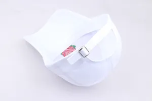 Detail of red rose embroidery inside a white cotton baseball cap with adjustable metal buckle
