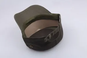 Detail of adjustable metal buckle and breathable eyelets on army green flat top cap