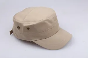Detail of cotton cadet cap showing metal eyelets and decorative stitching on the brim