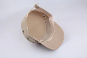 Internal detail of cotton flat top cap showing sweatband and adjustable metal eyelets