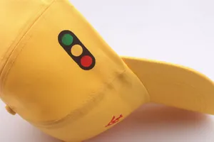 Yellow cotton baseball cap with traffic light graphic and side embroidery detail