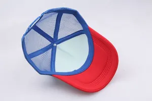 Detail of red and blue bicolor trucker hat with breathable mesh and curved brim