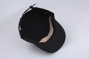 Detail view of cotton flat top hat featuring adjustable metal buckle and inner sweatband