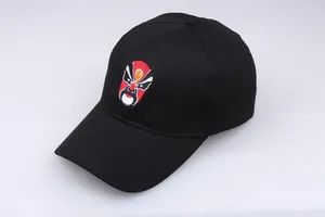 Detail of Peking Opera embroidery on black cotton baseball cap with curved brim