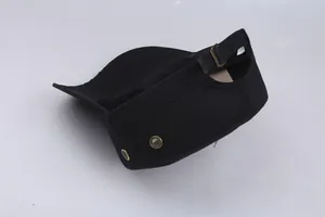 Detail of adjustable metal buckle and ventilation eyelets on cotton cadet cap