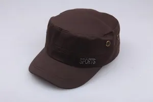Detail of dark coffee cotton flat top hat with brass eyelets and metal SPORTS badge