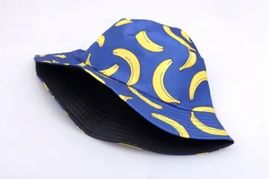 Detail of blue reversible bucket hat with yellow banana print and reinforced stitching
