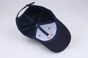 Inside view of navy cotton baseball cap showing six-panel structure and metal buckle