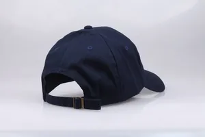Navy blue cotton baseball cap rear view with adjustable strap and metal buckle
