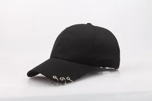 Detail view of the silver metal rings on the side of this black canvas baseball cap