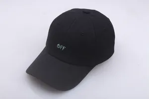 Close-up of black cotton baseball cap showing detailed light blue OFF embroidery and texture