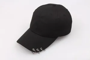 Classic black cotton baseball cap with three silver metal rings on the brim in punk style